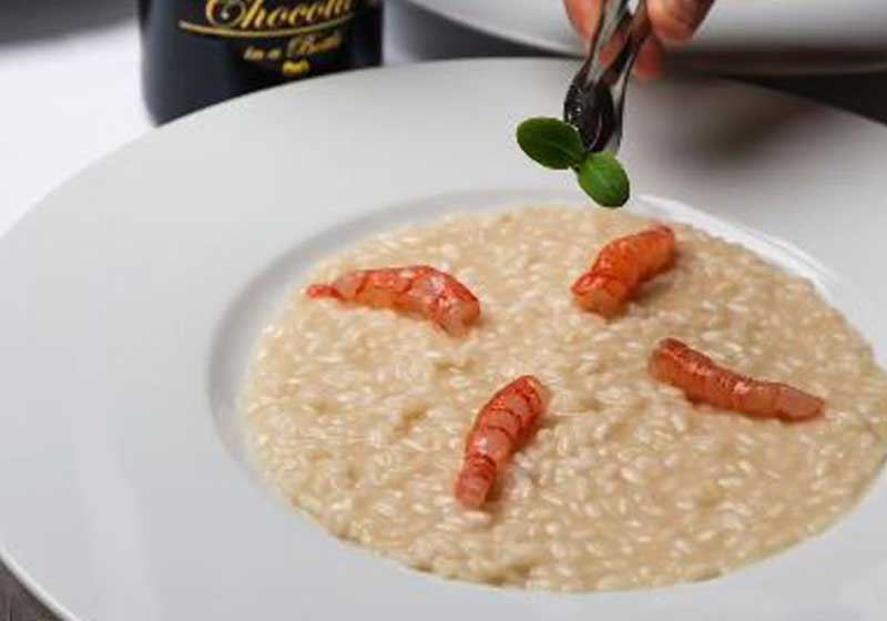 Risotto with Sicilian Raw Red Prawns, Blueberries and Dark Chocolate Flakes